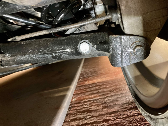 Marked offset flange bolt head. 