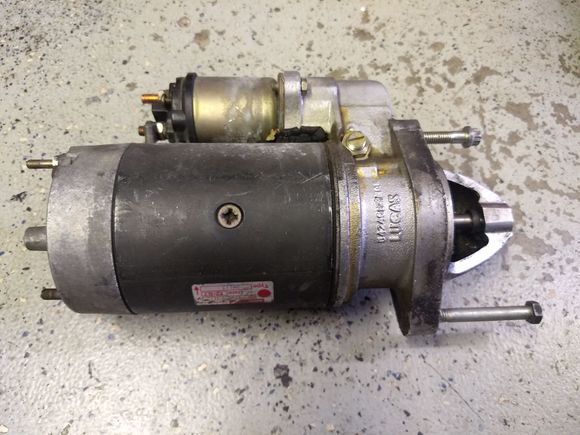 The top bolt by the solenoid is the one in question.