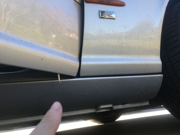 Front drain hole location shown with my small screwdriver. 