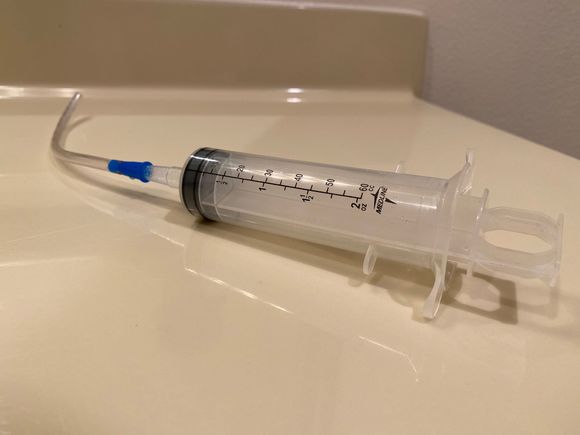 Syringe with 1/4” hose
