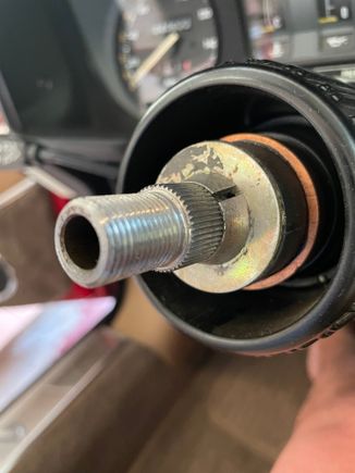 The two small conical collars that are compressed by the nut are shown here still engaged to the spline 