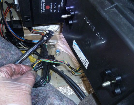 2 nylock nuts and a bolt used to mount the rear muffler bracket. Accessible in the trunk under the carpet