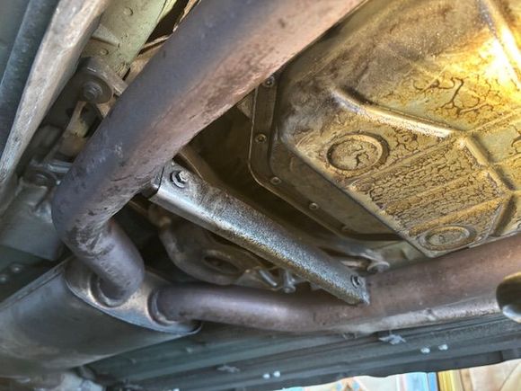 I'm thinking these 2 bolts have to come off to lower the exhaust pipes enough so the CAT can be dropped