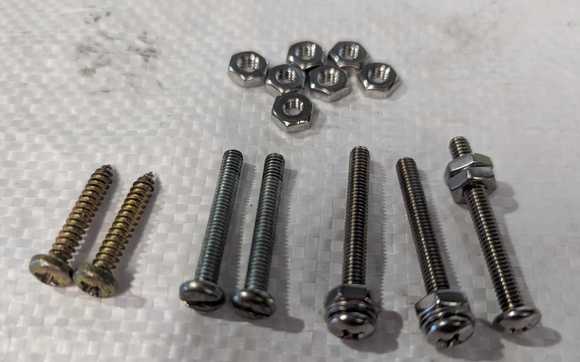 ST screws for horn push on left.
Then 2 Jag screws, then better version. On right the shoulder screw.
