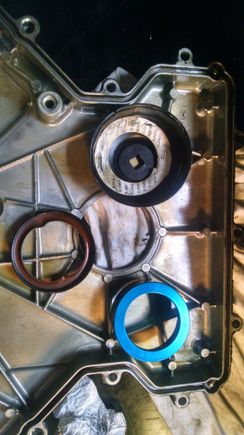 I removed the front crankshaft seal with one piece from the kit and I put an oil filter socket behind the timing cover, then tapped the seal out.   I will install the new seal prior to installing the timing cover.