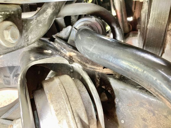 LHS front bolt is hard to access due to the pipe that runs directly above it. Fitted a 13mm 1/4 drive socket on the bolt then prized a small ratchet into the socket. 