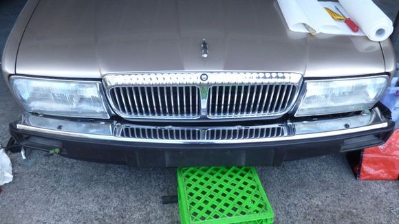 Top chrome section and washer jets reassembled to the beam