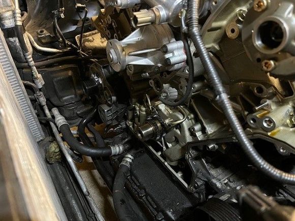 New water pump, front end open (what a struggle to get the steering pump bracket out of the way)