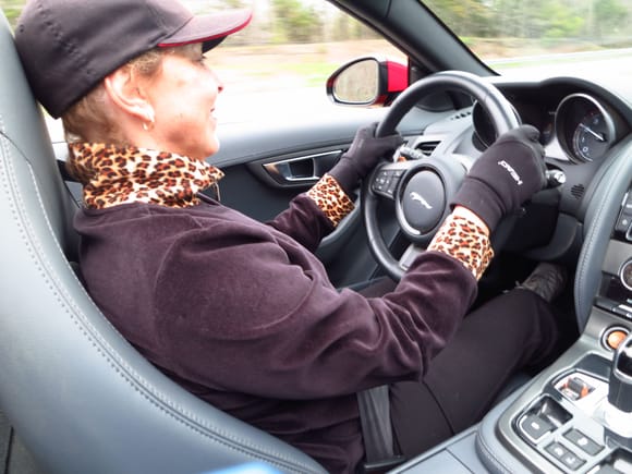 Bonnie (secretary of J.A.N.E), behind the wheel of my car. Luckily, you can't see the speedometer. The drain plug of her E-type wouldn't seal properly, so she was my welcome copilot.