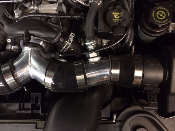 This is how I did the breather hose. I can't weld aluminum so I used a "silicone port system" and a very small amount of JB Weld on the inner flange and the outer nut assembly. The JB Weld is the heavy duty 550 degree stuff. I have used this same stuff on turbo blow off valve flanges that refused to seal.