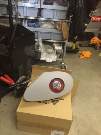 Epoxy tube and light into assy.  Sand edges of tube flush with lens.  Bondo imperfections, sand, bondo, sand, bondo more sand more prime sand prime sand until perfect.