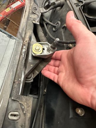 I loosened this bolt but did need remove it. Lifting up the linkage a little gets you just enough clearance. 