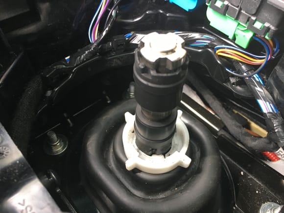 Important: observe exactly the order and position of the two rubber bushings on the remaining lower shaft so you put them back in the same way. Pull up on the upper bushing and remove.
