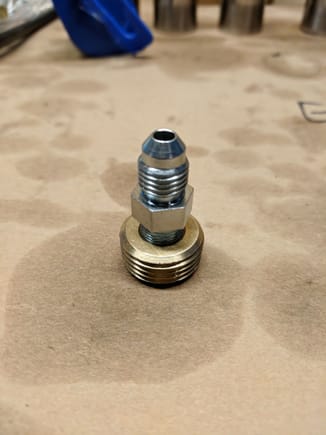 1/2" NPT to 1/18 NPT adaptor (with no hex head on it), mated to a 1/8" NPT to -4AN adaptor