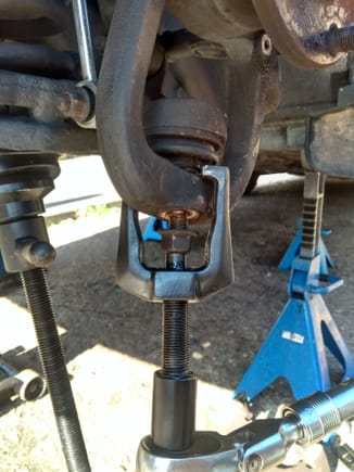 Best tool for removing vertical link to lower ball joint connection. You need to remove brake discs and dust shield though