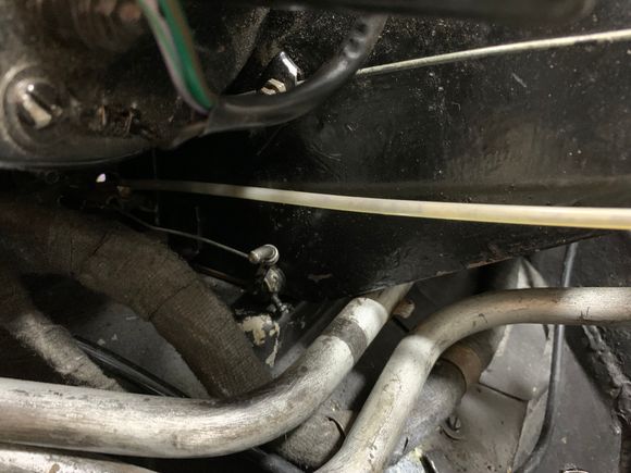Showing the cable from the Car/Screen lever within the car to the lever attachment of the opening flap