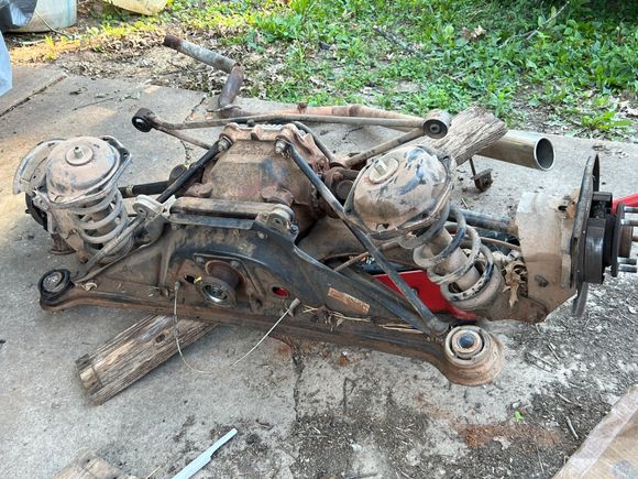 Complete rear axle assembly out for refitting with a salvage differential