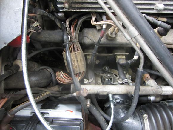 The shiny new metal cable is the new throttle cable.