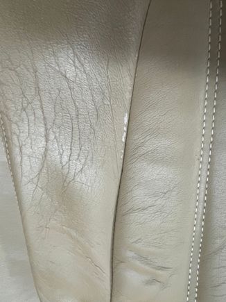 SLIGHT WEAR ON SEAT BACK AT SEAM