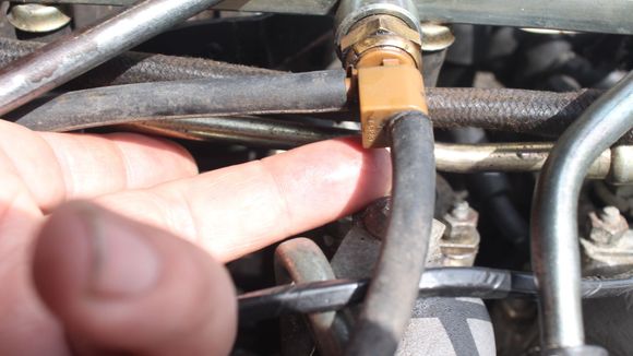 An Oily Petrol like Substance was leaking from here, where these Rubber Tubes join onto the Thermal Switch for (Hot Starting) and had that same 'Sweet Sickly Smell' that I had noticed when we were out 'Tripping'
