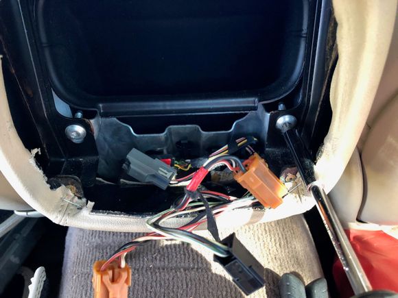 Unplug the connectors and remove the other two screws.