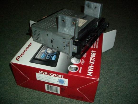 This shows the Jaguar radio with the new mounting brackets on top