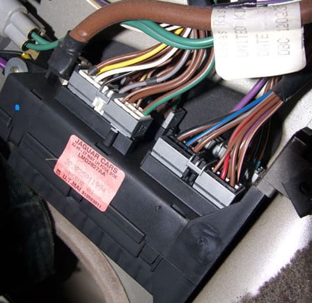 remove the rear plugs and the large brown cable to remove the fusebox