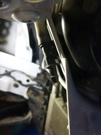 This is where you disconnect the headlamp washers water supply before dropping the bumper cover.