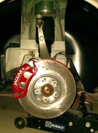 New Arnott Shock in place. Position top of shock with the brass fitting towards the front of vehicle.