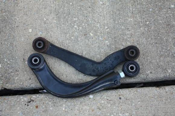 What the two arm look like side by side.  The orientation is correct.  The new arm (bottom) is from a Volvo S40/V60.  I bought mine on E-bay for $112.50 delivered to my house.  Install takes all of 30 minutes as long as the bolts cooperate.