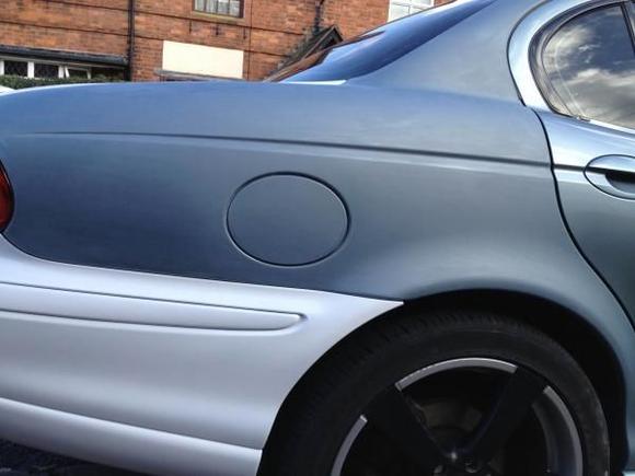 Day 3 - Rear offside quarter and roof line painting time.  This shows the rubbed and wiped down surface.