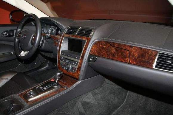 I like the wood. Aluminum  dash inserts makes it look cheap.