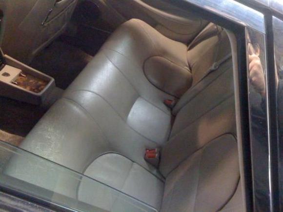 Old, cracked, and sun damaged leather seats.