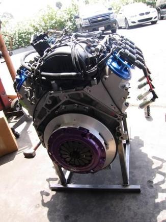 Finally finished!  the engine is complete and ready for the trans.  Flywheel and pressure plate have all been carefully torqued and double checked.  With so little rotational inertia at the crank, this big V8 should rev like an F-1 engine!  ok, maybe not quite like an F-1 engine but, it ought to be quite responsive.
