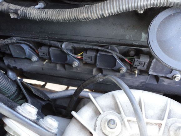 You might be able to see where the plastic studs for the coil cover insert into the timing chain cover in this right side photo