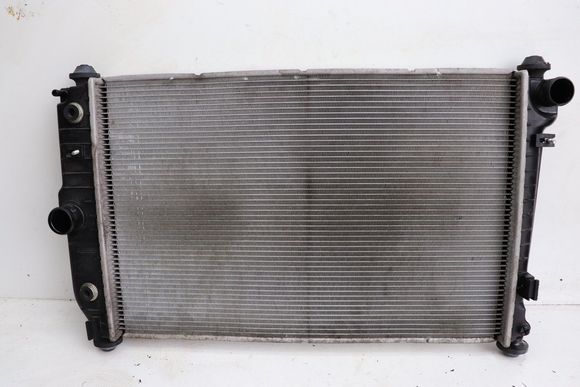 Aston Martin OE Radiator (Plastic End Tanks): 

Engine side
Ebay: $496.00 USD ($789 AUD)