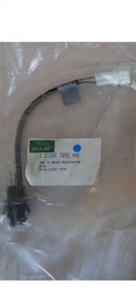 Unfortunately without tearing mine apart again, this is the best pic i can find on google right now which is actually off the auction i mentioned. I am looking at aftermarket too, but am concerned they wont "click" into place due to not having listed measurements.  I have seen the ones that actually have a nut to hold them on, but I haven't measured the cowl yet to see how long the shank would have to be to work properly 