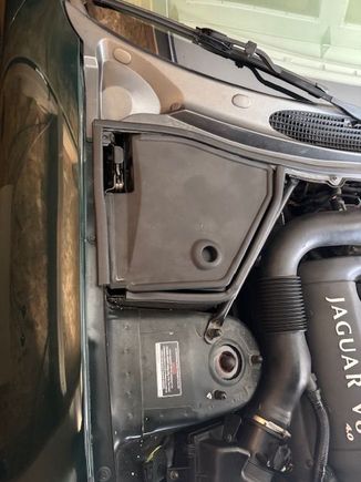 This is the compartment on the right side of the engine compartment.