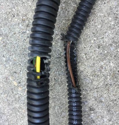 The copper of 2 of the wires became exposed. Presume it was against something too hot (was not near moving parts).