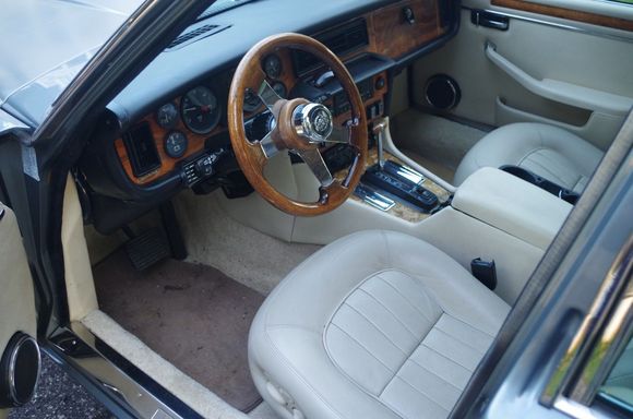 Better interior shot, and here's the infamous steering wheel. That hubcap doubles as a working horn button (and face-smasher if you're too close to the wheel during an accident, I'm sure).