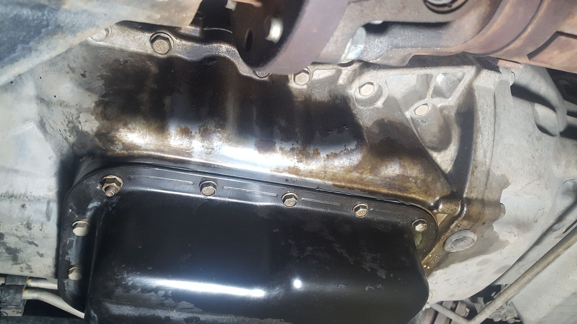 Small oil leak / Oil pan questions. The top