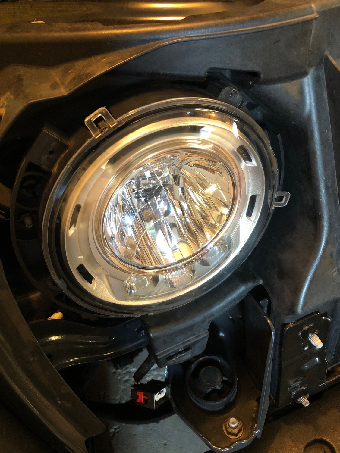 How to remove factory headlights in 2018 JK? The top
