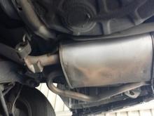 20140708 130808
This is the premuffler before it was removed. There is a hole on the top side that is as big as the muffler. The sheet metal skin on the top of the body is separating from the seams on either end, essentially providing NO muffle effect as all the exhaust exits the gaping hole.