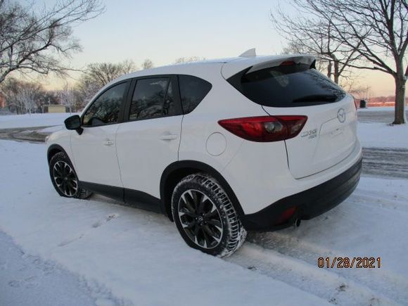 2016.5 CX-5 AWD, rear quarter view.