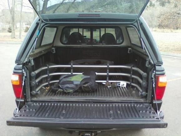 Came with the stock plastic bedliner (I've heard of some rust problems with them, but shouldn't be an issue yet for an '02 right?), along with a metal bed extender.  Nice to have.