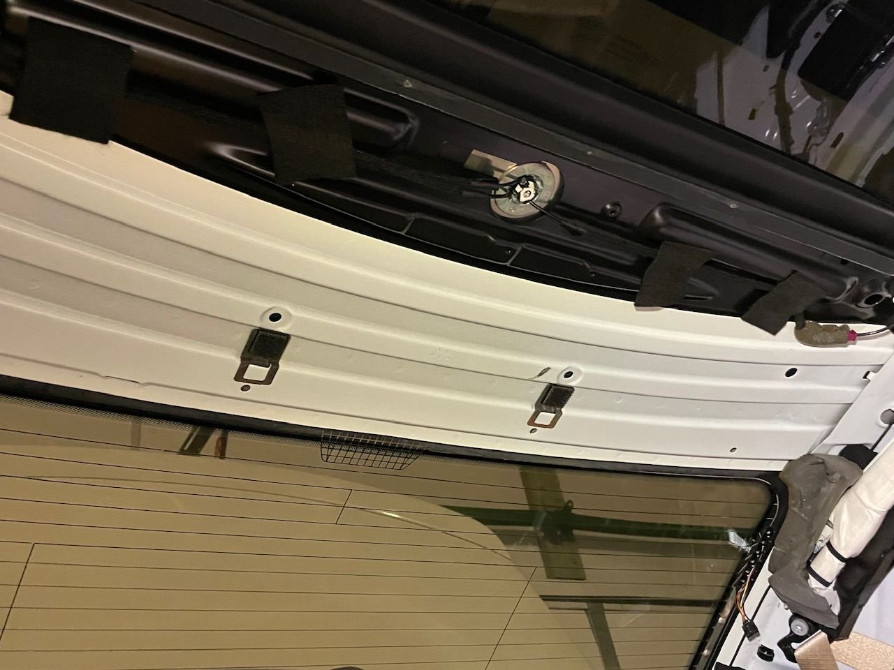 These are the industrial strength Velcro pieces in the rear which will be the last things you attached upon install.