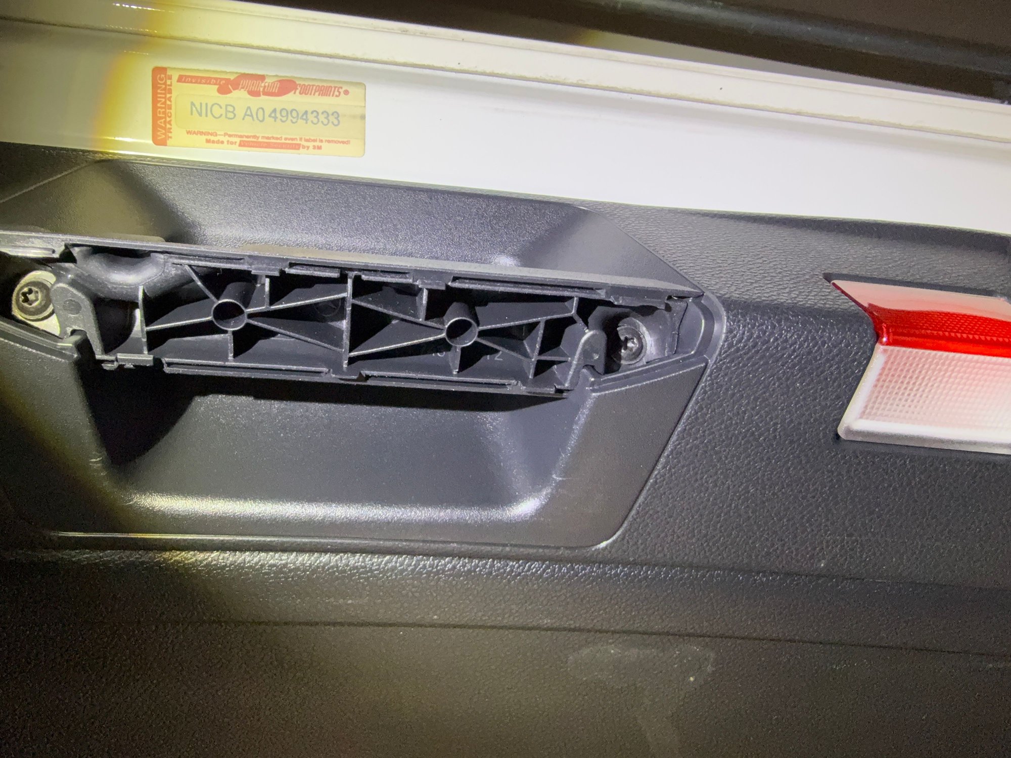 2 screws to be removed once handle covers are pried off. 