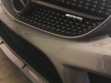 I wrapped the chrome part with 3M carbon fiber (not hard) and PlastiDipped the front star (also easy). 