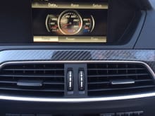 CF interior trim and AMG Media Temp screen showing