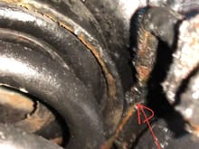 Paint stripped by brake fluid indicates leak area…